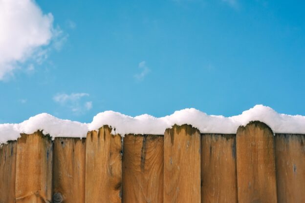 Fence with snow covered top